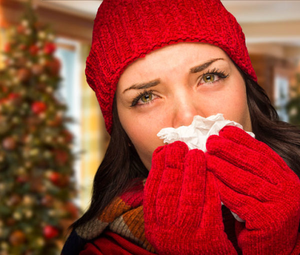 Woman blowing nose